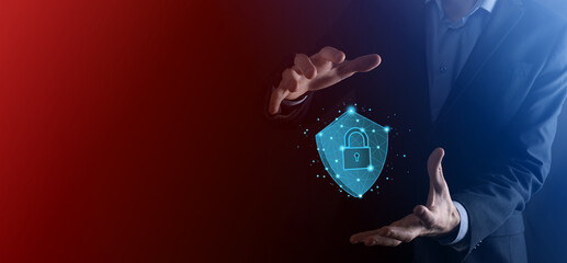 Businessman hold low poly polygon shield with a padlock icon.Secure Access System Concept.Business...