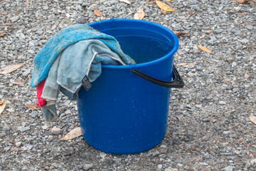 A bucket with water and rags.