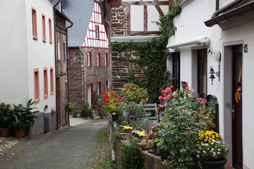 Fototapeta na wymiar Half-timbered houses in the Old Alley ,Romantic wine village of Bremm on the Moselle River, Rhineland-Palatinate, Germany, Europe