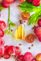 Grape seed oil in a bottle. Selective focus.