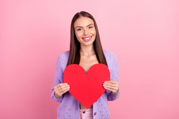 Photo of romantic lady hold red paper heart figure card wear violet cardigan isolated pink color background