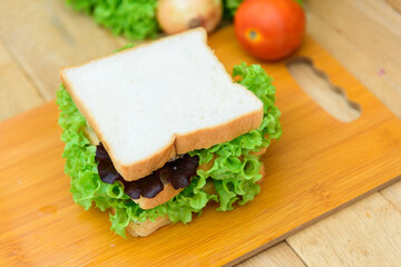 Sandwich tuna on wood plate