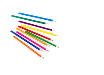 Fototapeta premium Colored wooden pencils on a white background. Horizontal orientation, copy space, top view.