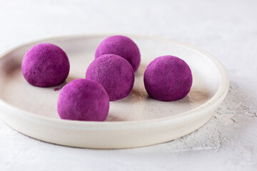 Obraz na płótnie Canvas Vegan truffles in sweet potato powder. Sugar, gluten and lactose free.