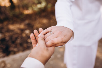 bride and groom holding hands