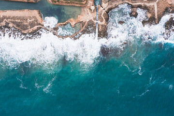 Aerial view of waves splashing on beach