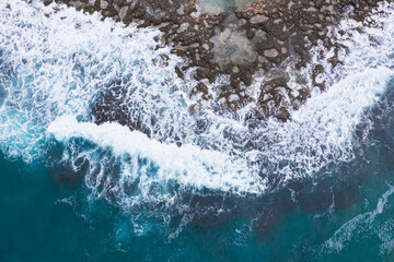 Aerial view of waves splashing on beach