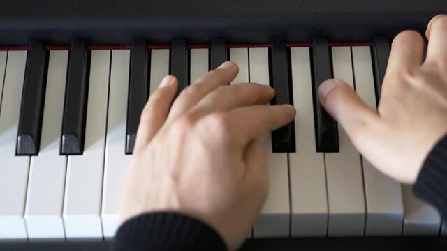 Close-up of Female Hands Playing The Piano, Slow Motion With Selected Focus