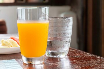 Breakfast set, orange juice and fresh fruit