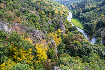 Viewpoint over river valley and colorful forests