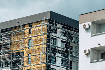 Mineral wool insulation of high-rise apartment building in residential district © Bits and Splits