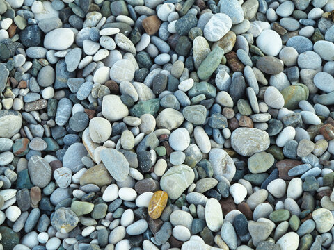 Sea colorful and gray small stones pebbles on a beach