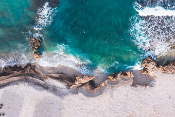 Aerial view of waves splashing on beach