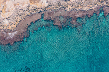 Aerial view of waves splashing on beach