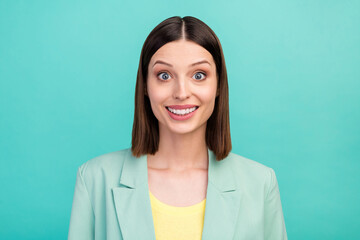Fototapeta premium Photo of impressed young brunette lady wear blazer isolated on cyan color background