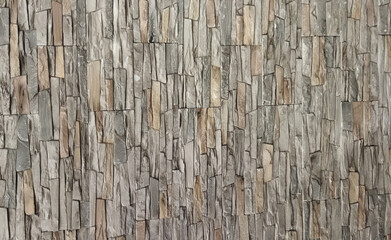 Relief texture in gray and beige. Plaster wall close-up. Gray background.
