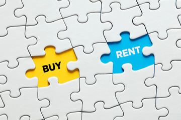 Missing puzzle pieces with the words buy and rent. Business decision