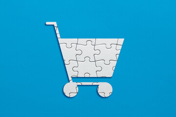 Shopping cart symbol made out of puzzle pieces © Cagkan