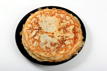 Pancakes on the black plate.Stack of tasty pancakes on white background. delicious pancakes in a stack 