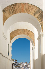Beautiful arches in the Jewish quarter of Vejer de la Frontera. Cadiz, Andalusia, Spain