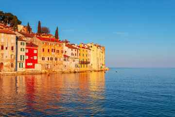 Naklejka premium Rovinj cozy little seaside old town with harbor on the Istrian peninsula in Adriatic sea at sunrise