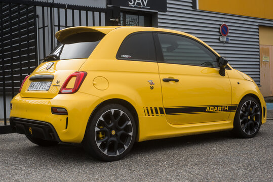 Mulhouse - France - 10 October 2021 - Rear view of yellow Fiat 500 abarth 595 parked in the street