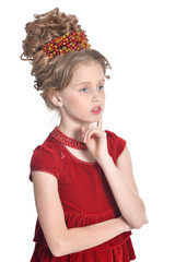 Portrait of cute girl in red dress posing isolated