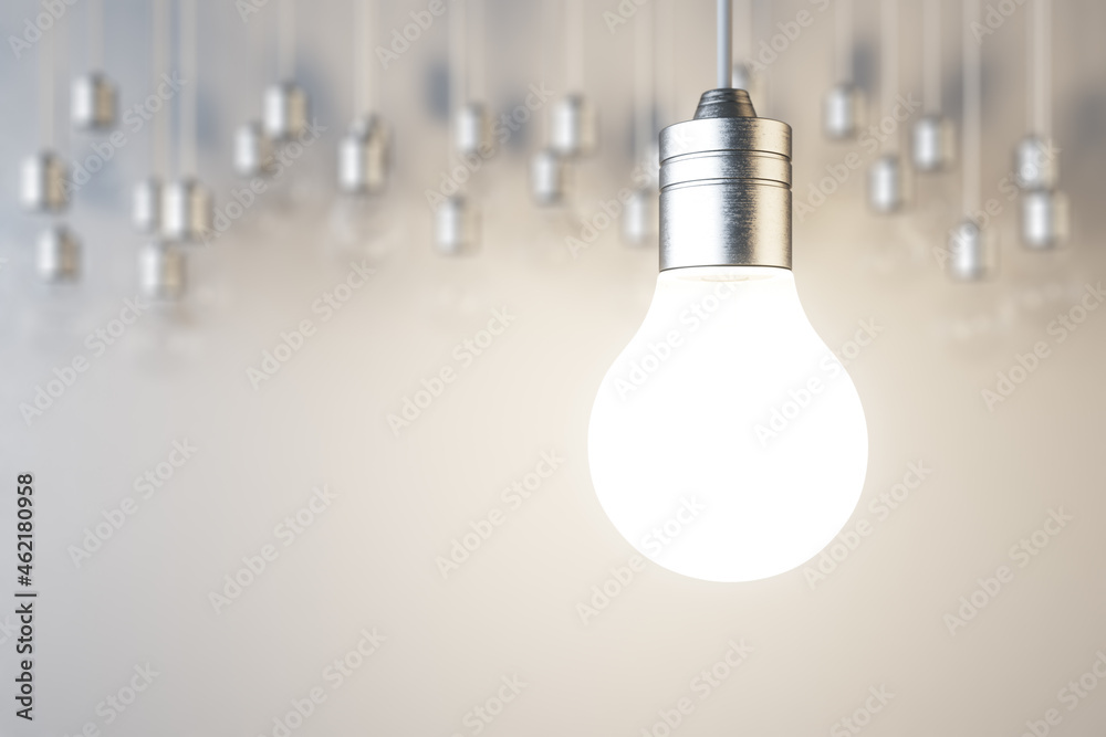 Aufkleber glowing lamp on blurry concrete wall background. idea, innovation, solution and invention concept. m