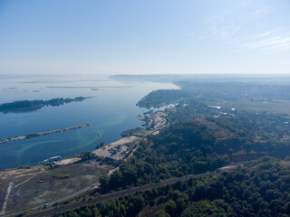 River bank with cargo berths for sand unloading, aerial view