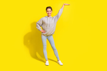 Full body photo of cool brown hair millennial lady measure wear sportcloth jeans sneakers isolated...