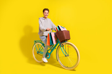 Full body photo of crazy brown hair millennial lady ride bicecly with bags wear sweater jeans...
