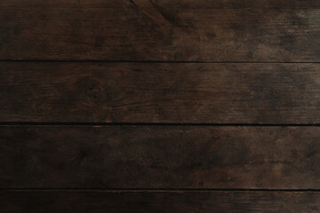 Naklejka premium Old dark brown wooden background. Timber board texture