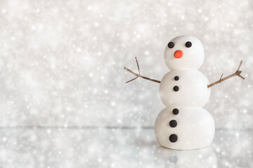 Cute snowman figure on winter frozen background with snowflakes. Mockup, artificial scene, greeting...