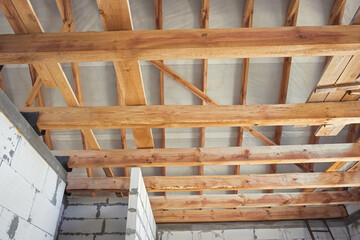 Timber frame of the roof of the new house. Roofing structures. Wooden structures