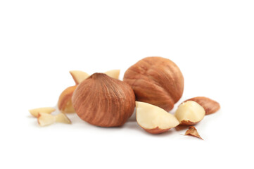 Heap of tasty hazelnuts on white background