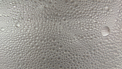 Close up of water drops on plastic, Abstract gray wet texture with bubbles on plastic