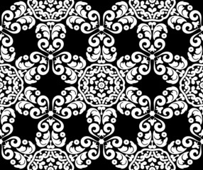 Fantastic white flowers on a black background. Seamless floral vintage pattern. Decorative ornate texture. Black and white. For fabric, wallpaper, venetian pattern,textile, packaging.