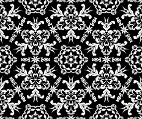 Floral seamless pattern in the style of baroque. Vector damask vintage ornament. Black and white. Vector illustration. For fabric, tile, wallpaper or packaging.