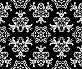 Vector template with white rococo flowers on black background. Vintage Victorian damask. Seamless abstract pattern. For textiles wallpaper tiles or packaging.