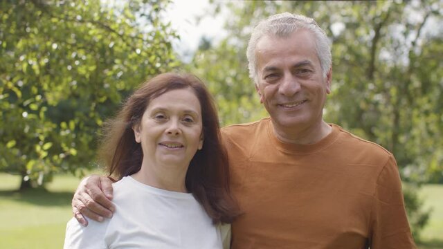 Senior Couple Portrait In Lush Gardens 01