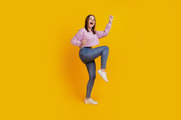 Fototapeta na wymiar Full body profile side photo of young excited girl celebrate win lottery isolated over yellow color background