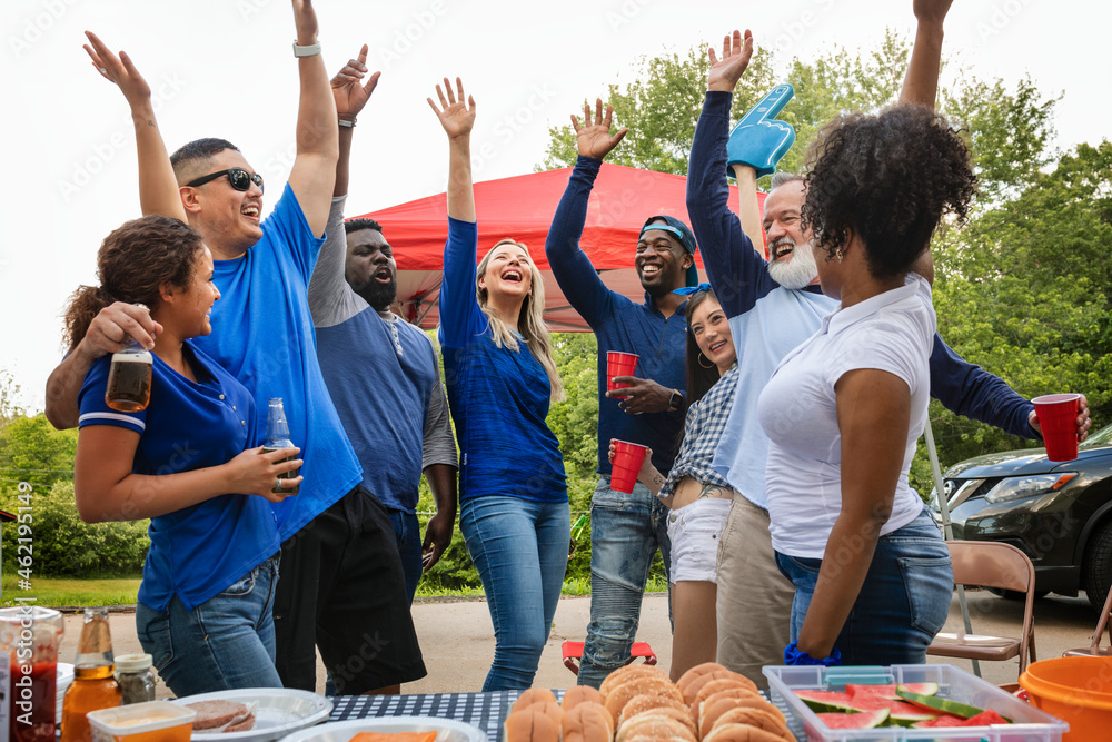 Wall mural Team supporters celebrating at a tailgate party