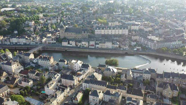 View from drone of houses and Mayenne river at Laval town at sunny summer day, France