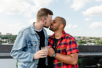 Cute gay couple kissing while on a date