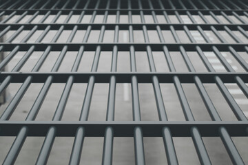 Close-up view from above through the bars of the prison area
