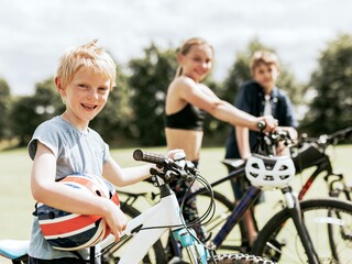 Kids riding bikes, enjoying summer holiday