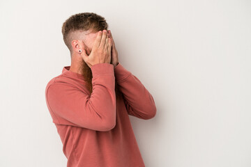 Young caucasian ginger man with long beard isolated on white background afraid covering eyes with hands.