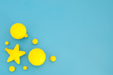 Blue and yellow Christmas composition. Trendy Xmas background, mockup. Modern design. Free space for text, copy space. Flat lay, top view