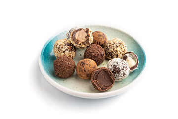 Chocolate truffle candies isolated on white background. side view.
