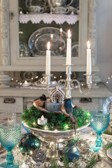 Christmas or New Year festive  table setting with candles and  vintage decoration